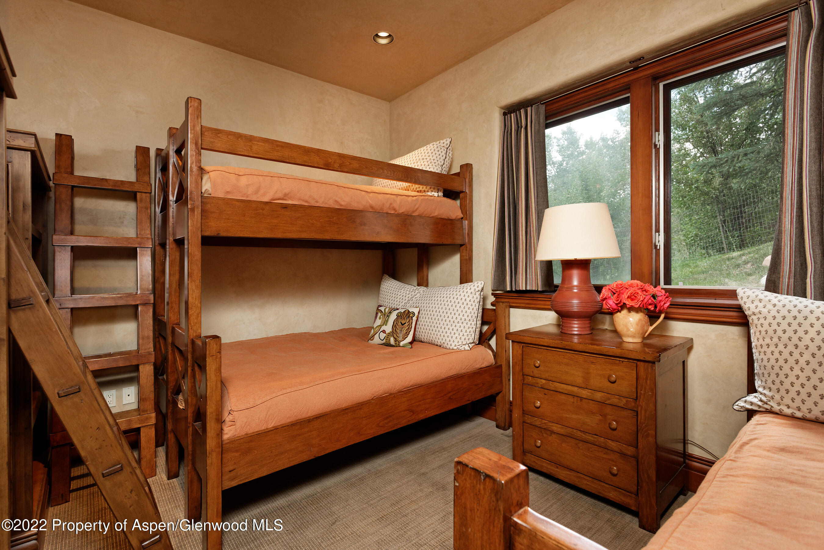 1225 Riverside Drive Aspen, CO 81611 - Photo 20 of 21 a bedroom with a bed and large windows