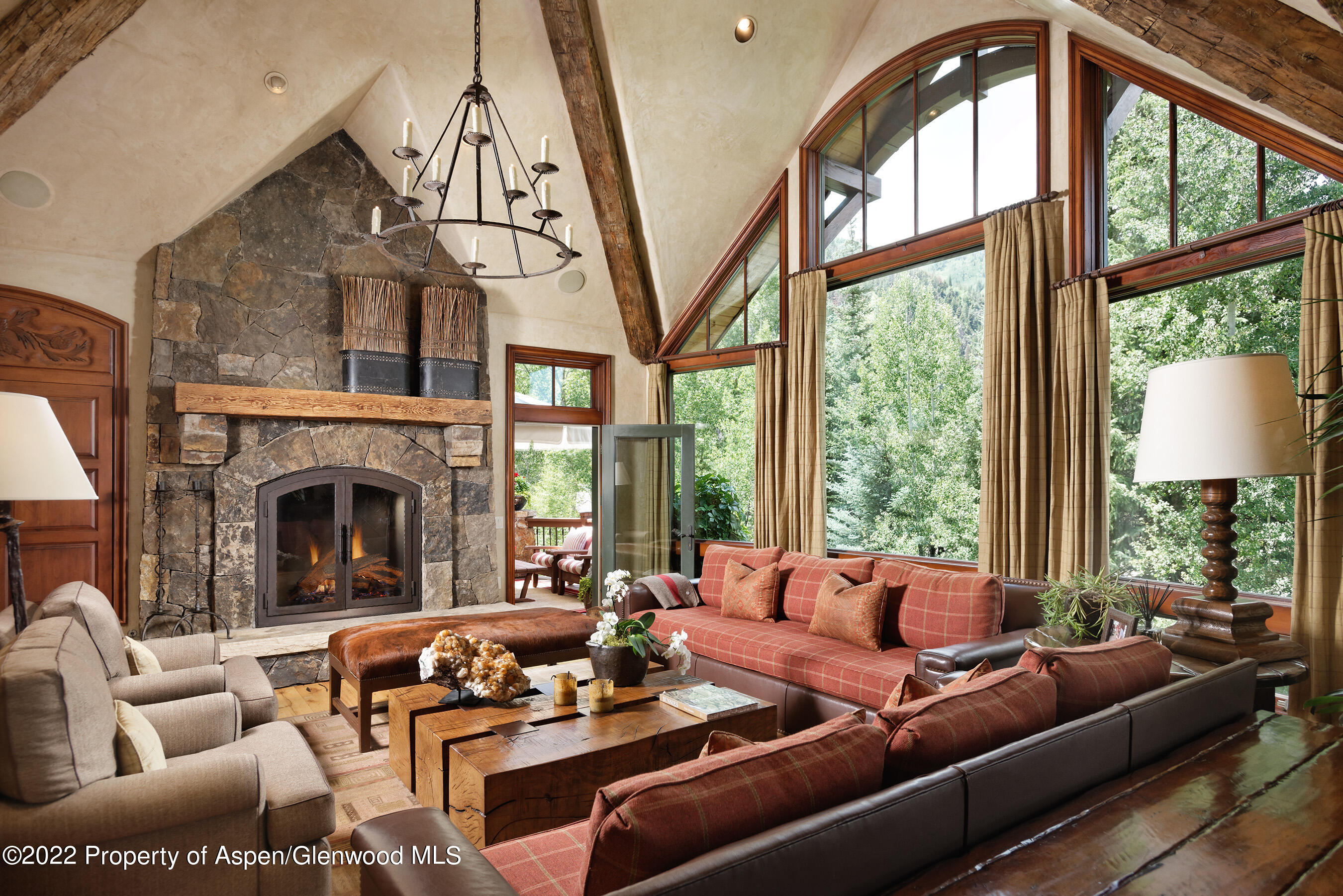 1225 Riverside Drive Aspen, CO 81611 - Photo 3 of 21 a living room with furniture fireplace and a large window