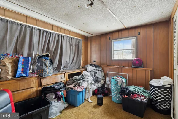 a room with lots of furniture and clutter