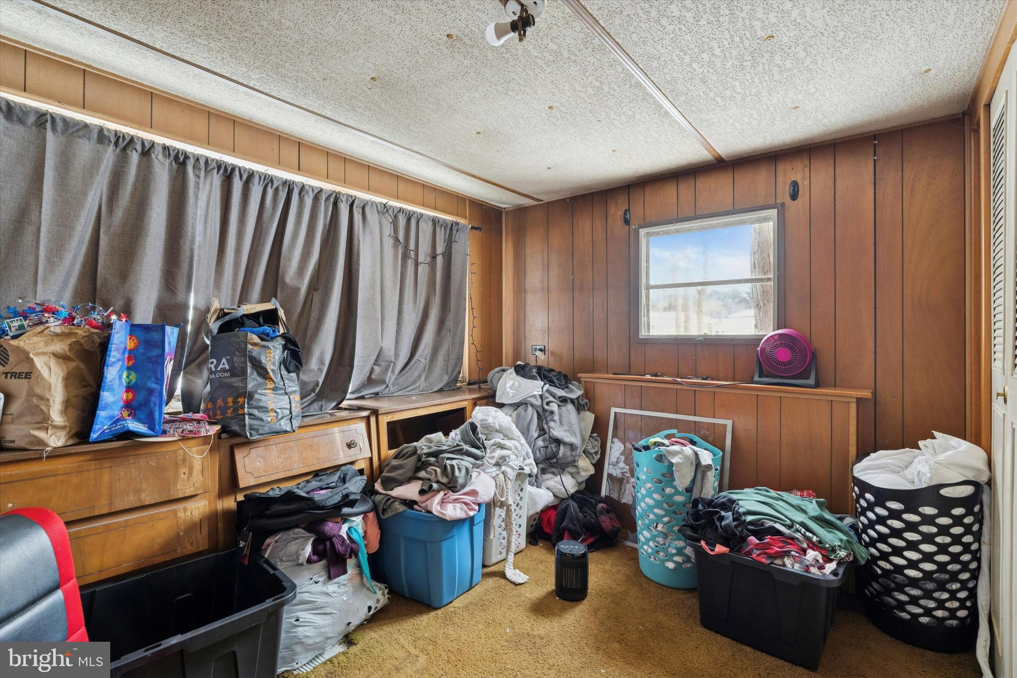165 West Ridge Pike, Unit 217 Limerick, PA 19468 - Photo 5 of 7 a room with lots of furniture and clutter