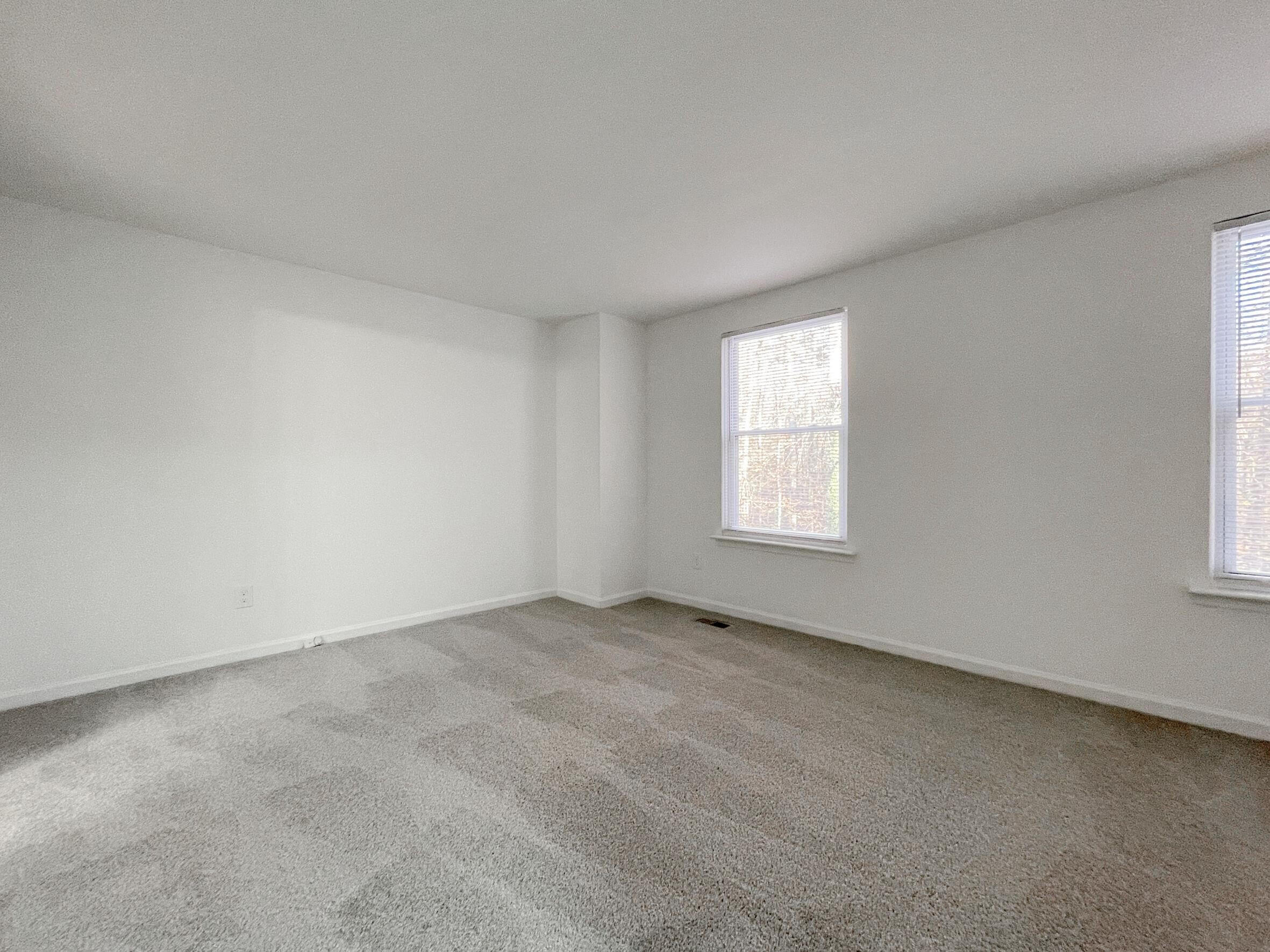 7328 Summerland Drive Raleigh, NC 27612 - Photo 13 of 27 an empty room with windows