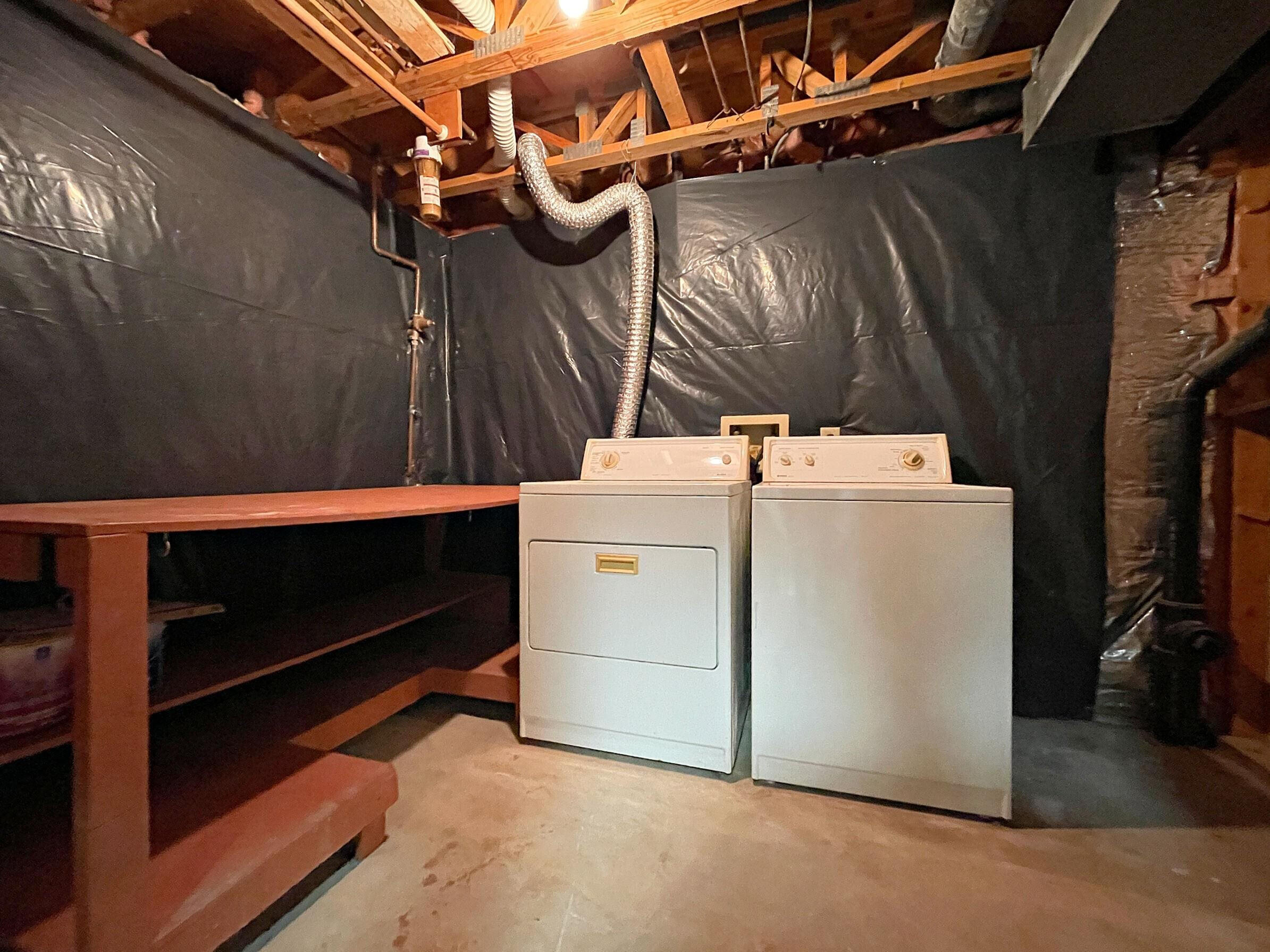 7328 Summerland Drive Raleigh, NC 27612 - Photo 20 of 27 a utility room with dryer and washer