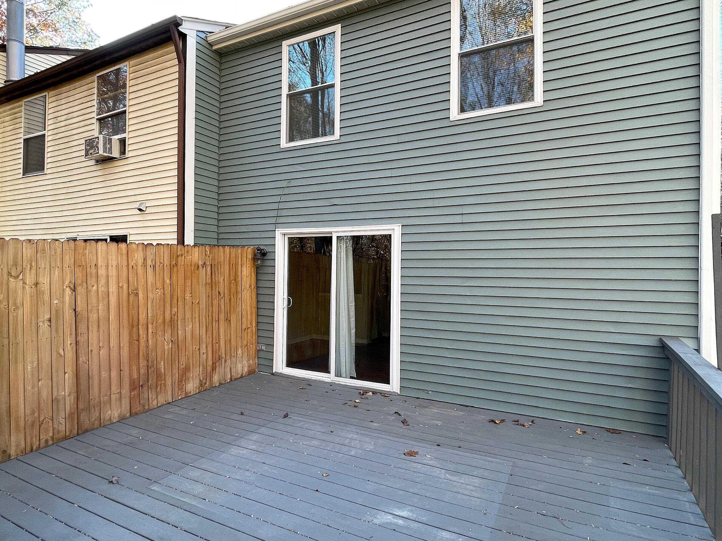 7328 Summerland Drive Raleigh, NC 27612 - Photo 23 of 27 a view of a house with wooden deck