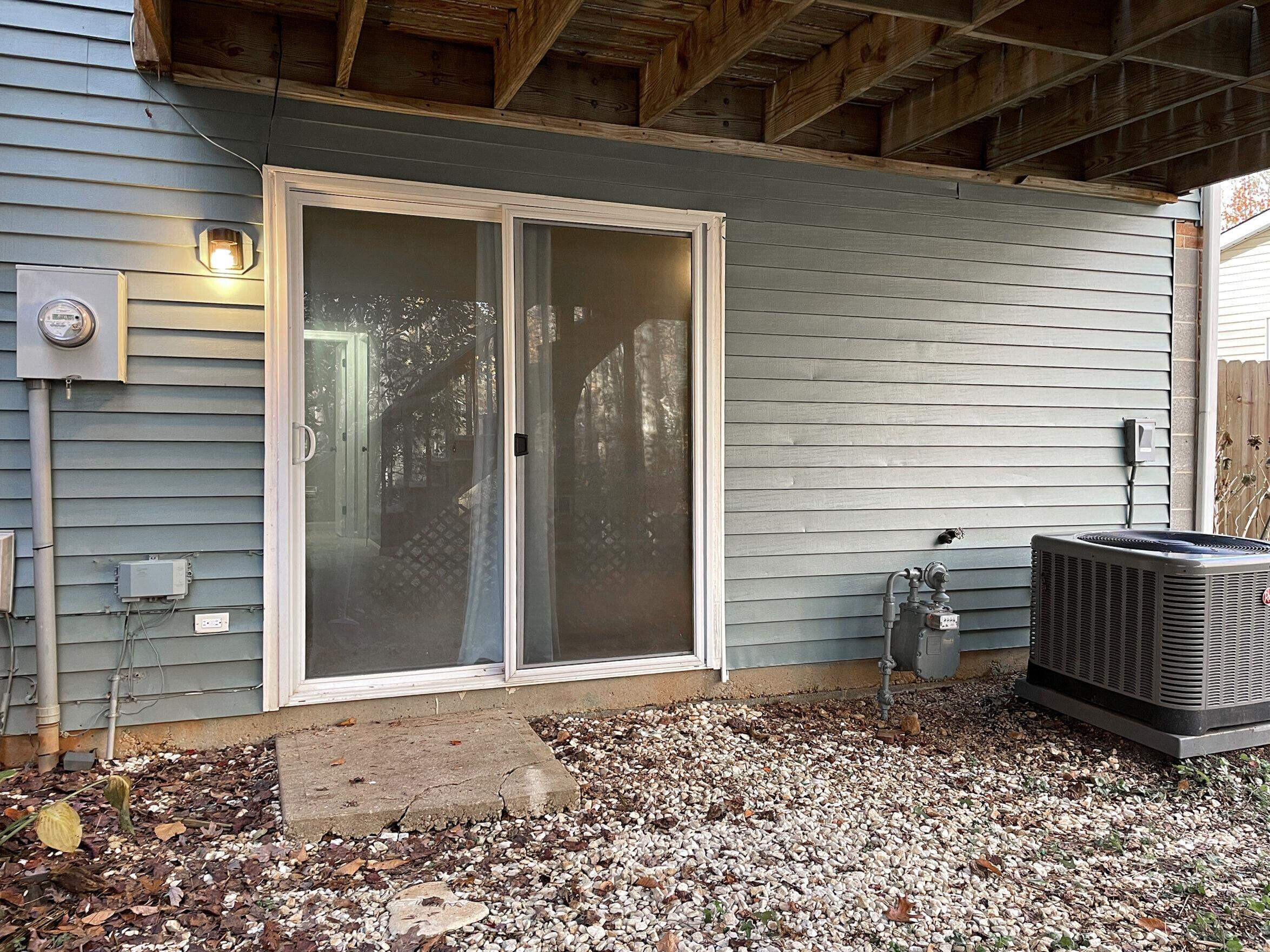 7328 Summerland Drive Raleigh, NC 27612 - Photo 24 of 27 a view of a porch with a door