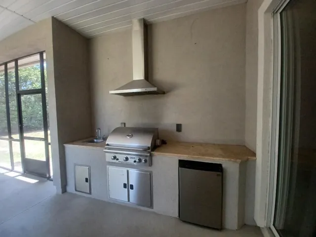 a kitchen with a stove and a microwave