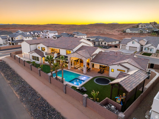 4871 South Homestead Way Washington, UT 84780 - Photo 142 of 151 Relaxing pool / spa featuring a residential view, a patio, and a fenced backyard