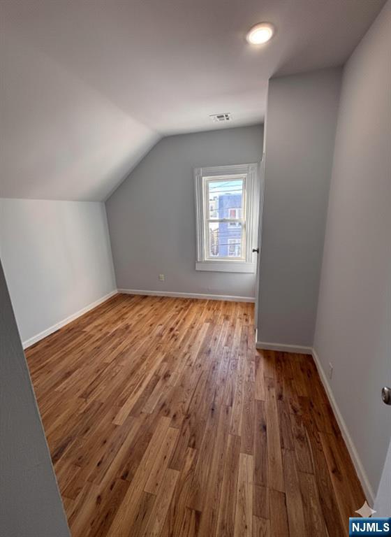 332 70th Street, Unit 2 Guttenberg, NJ 07093 - Photo 2 of 7 a view of empty room with wooden floor