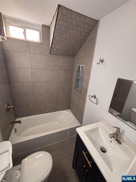 332 70th Street, Unit 2 Guttenberg, NJ 07093 - Photo 5 of 7 a bathroom with a sink a toilet and bathtub