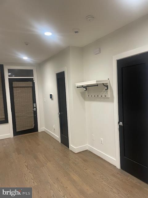 724 Taylor Street Northwest, Unit 1 Washington, DC 20011 - Photo 11 of 36 an empty room with closet and mirror