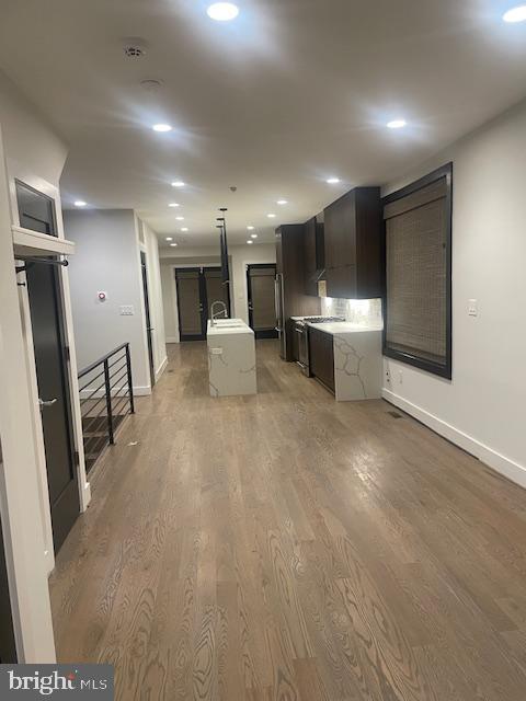 724 Taylor Street Northwest, Unit 1 Washington, DC 20011 - Photo 13 of 36 a open kitchen with stainless steel appliances kitchen island granite countertop a refrigerator and a stove