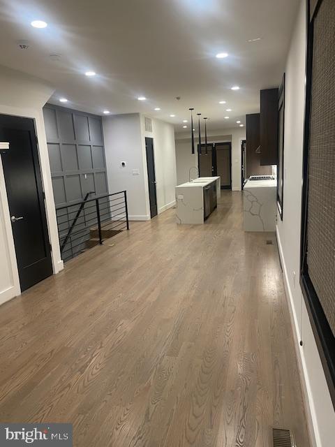 724 Taylor Street Northwest, Unit 1 Washington, DC 20011 - Photo 14 of 36 a view of a hallway with wooden floor