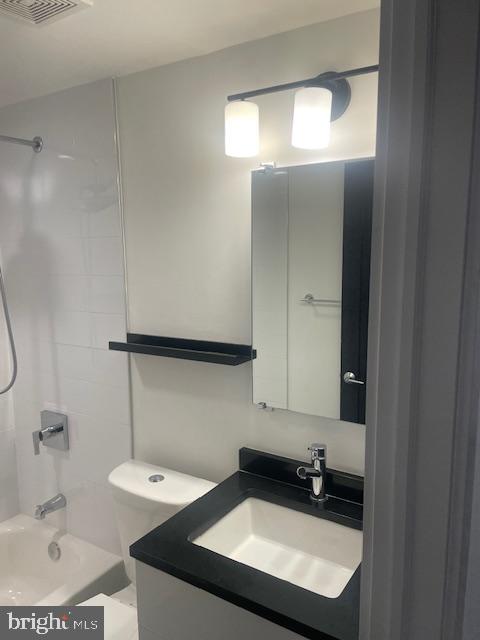 724 Taylor Street Northwest, Unit 1 Washington, DC 20011 - Photo 16 of 36 a bathroom with a sink and a mirror