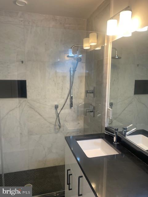 724 Taylor Street Northwest, Unit 1 Washington, DC 20011 - Photo 21 of 36 a bathroom with a sink and a mirror