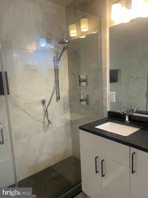 724 Taylor Street Northwest, Unit 1 Washington, DC 20011 - Photo 22 of 36 a bathroom with a sink and a mirror