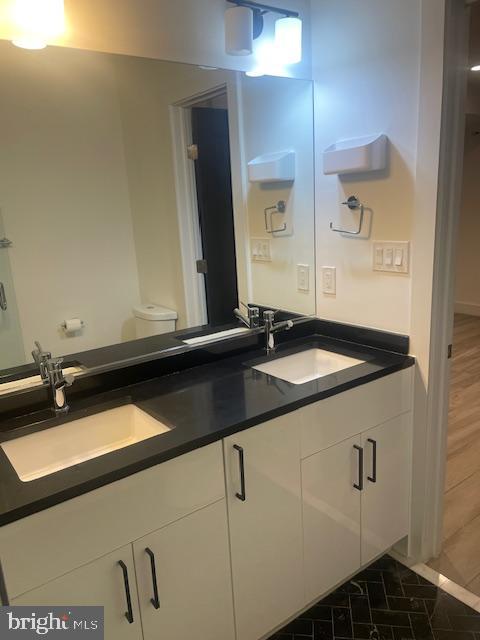 724 Taylor Street Northwest, Unit 1 Washington, DC 20011 - Photo 24 of 36 a close view of sink and mirror