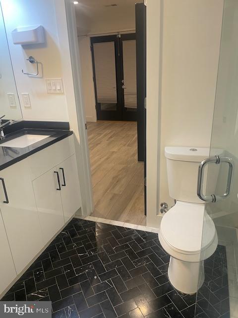 724 Taylor Street Northwest, Unit 1 Washington, DC 20011 - Photo 25 of 36 a bathroom with a sink and a toilet