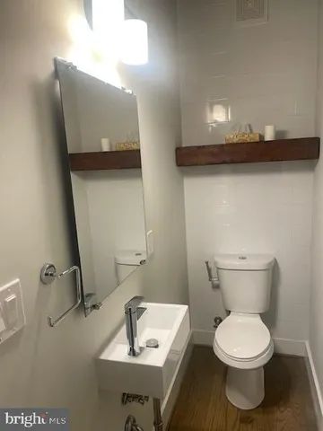 a large kitchen with a large counter top appliances and cabinets