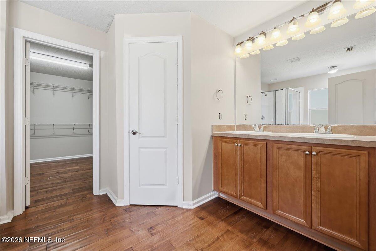 76134 Tideview Lane Yulee, FL 32097 - Photo 11 of 44 a bathroom with a sink and a mirror