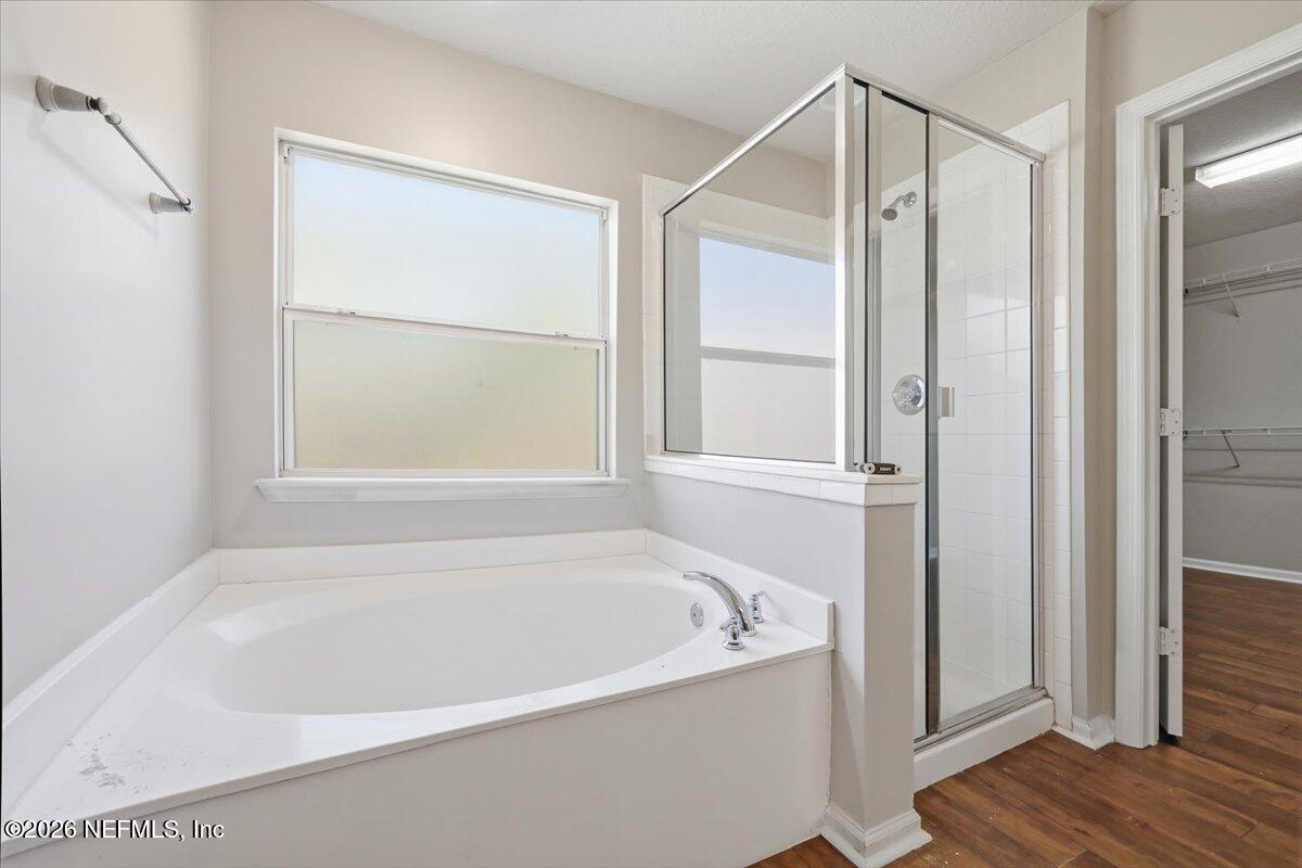 76134 Tideview Lane Yulee, FL 32097 - Photo 12 of 44 a white bath tub sitting next to a window