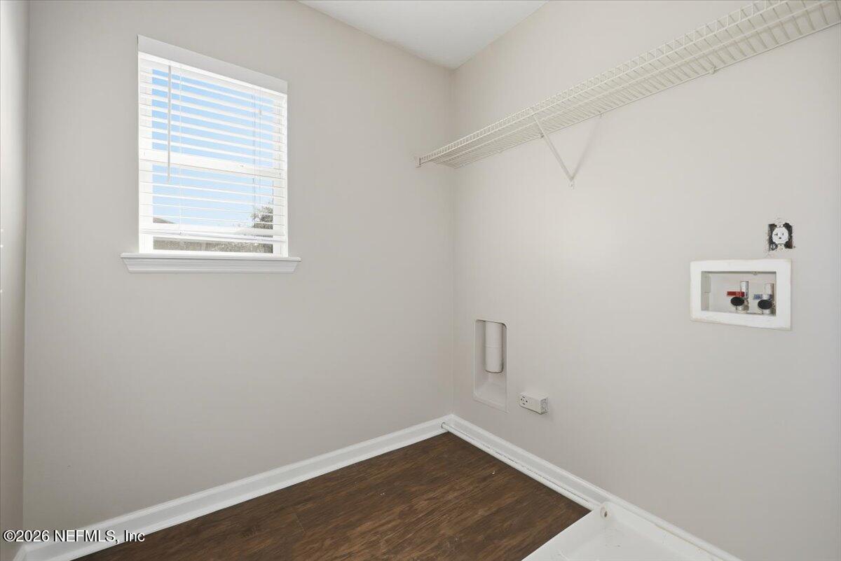 76134 Tideview Lane Yulee, FL 32097 - Photo 17 of 44 a view of a small space with wooden floor and a window