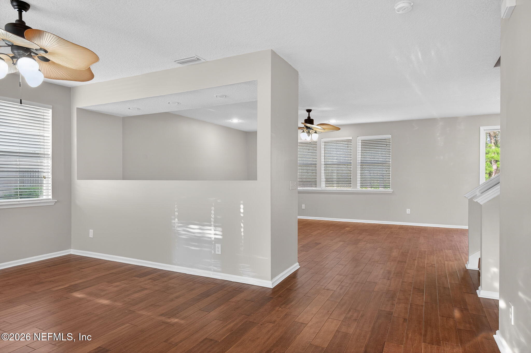76134 Tideview Lane Yulee, FL 32097 - Photo 20 of 44 a view of empty room with wooden floor and fan