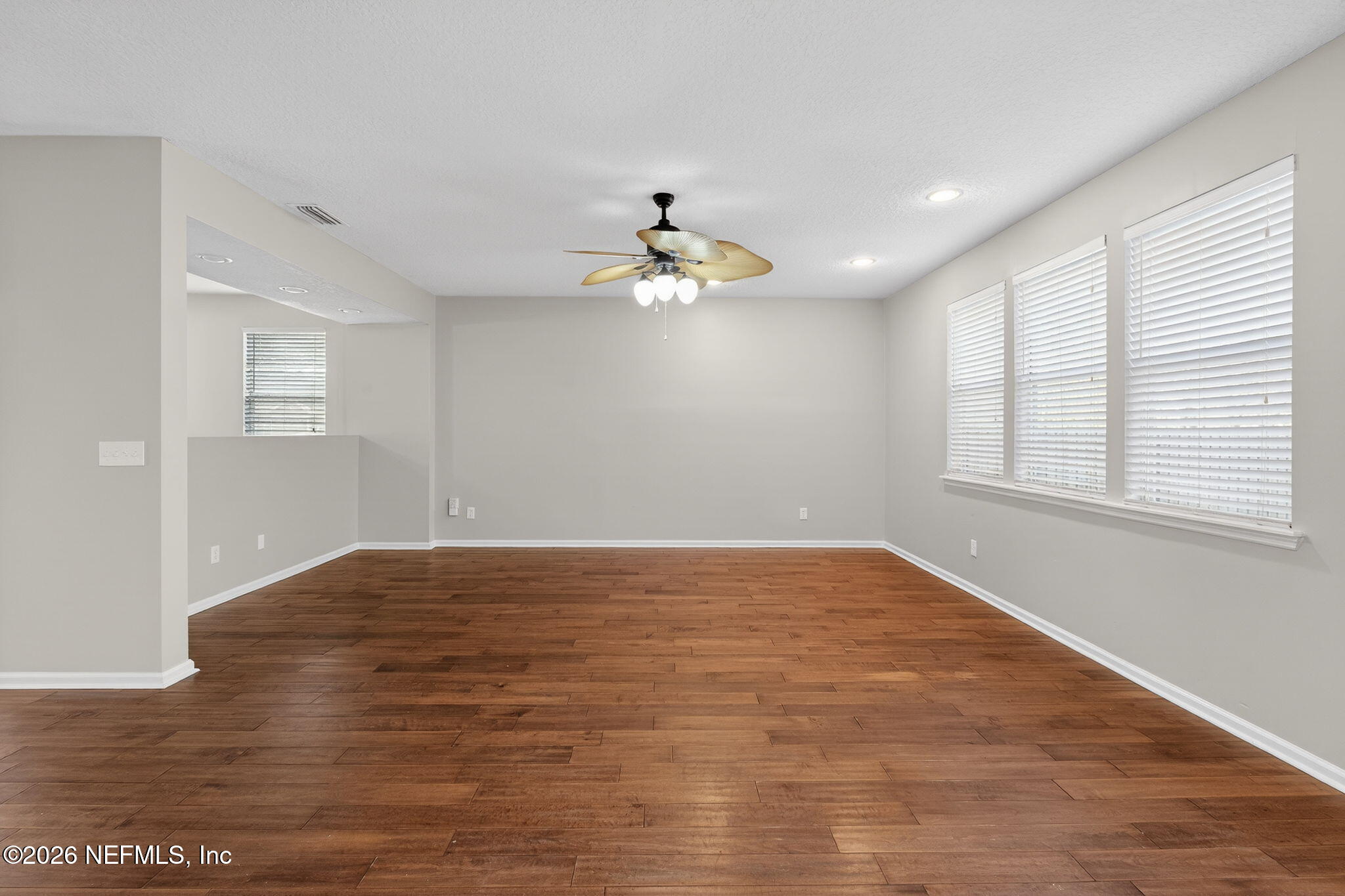 76134 Tideview Lane Yulee, FL 32097 - Photo 22 of 44 wooden floor in an empty room with a window
