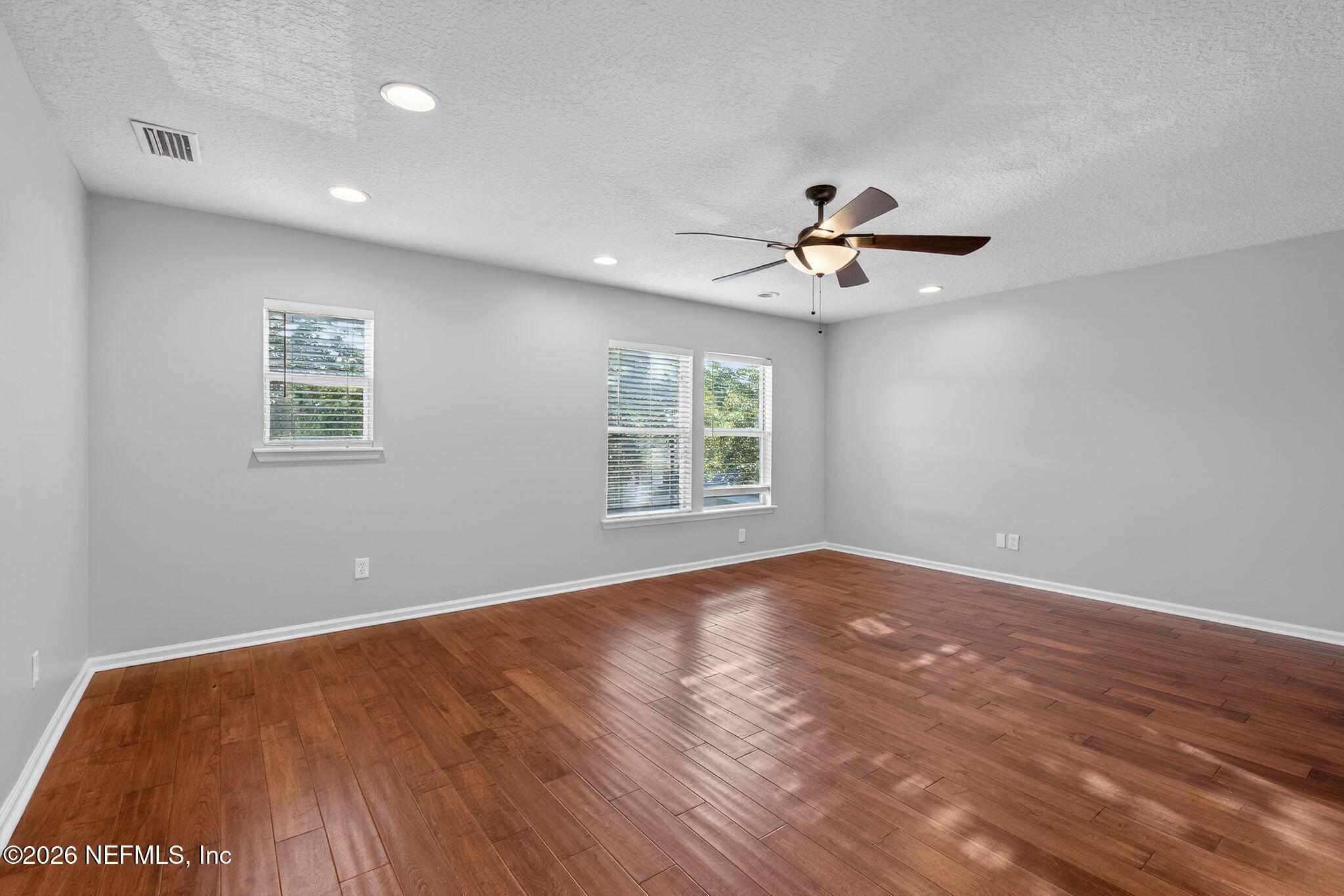 76134 Tideview Lane Yulee, FL 32097 - Photo 29 of 44 wooden floor in an empty room with a window