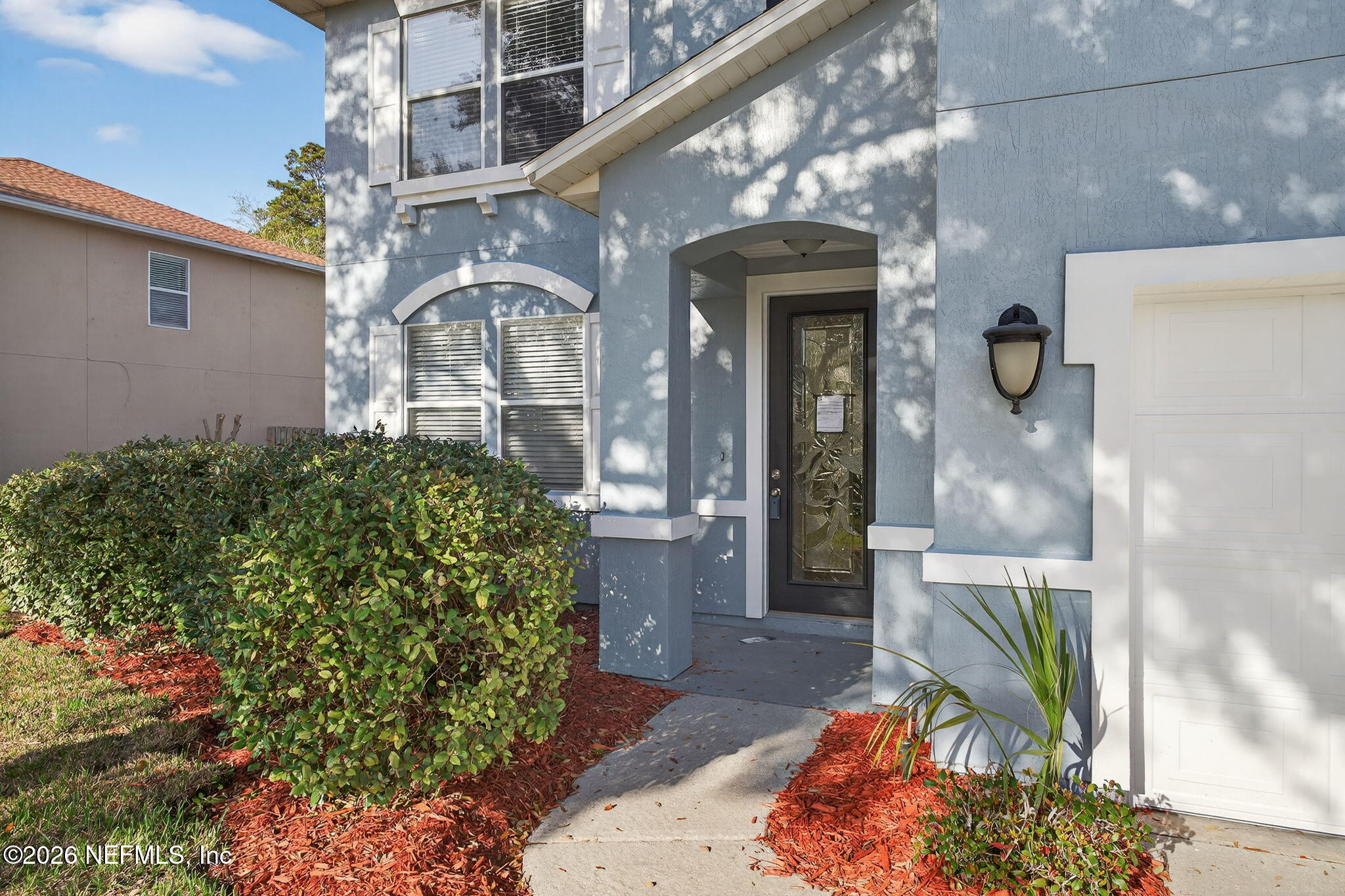 76134 Tideview Lane Yulee, FL 32097 - Photo 3 of 44 a front view of a house