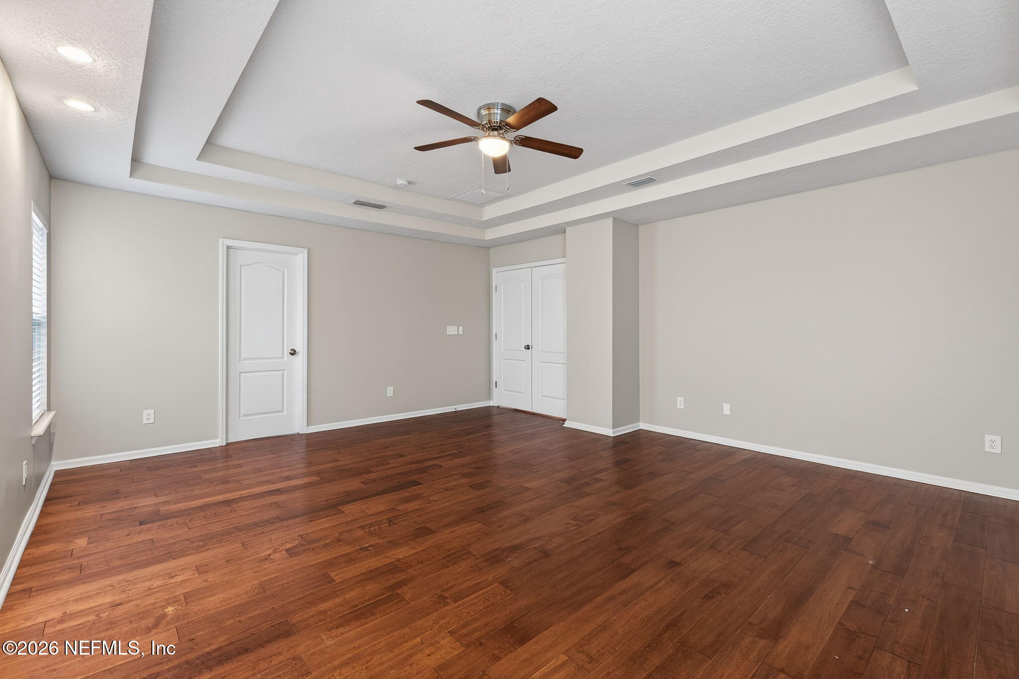 76134 Tideview Lane Yulee, FL 32097 - Photo 36 of 44 a view of empty room with wooden floor