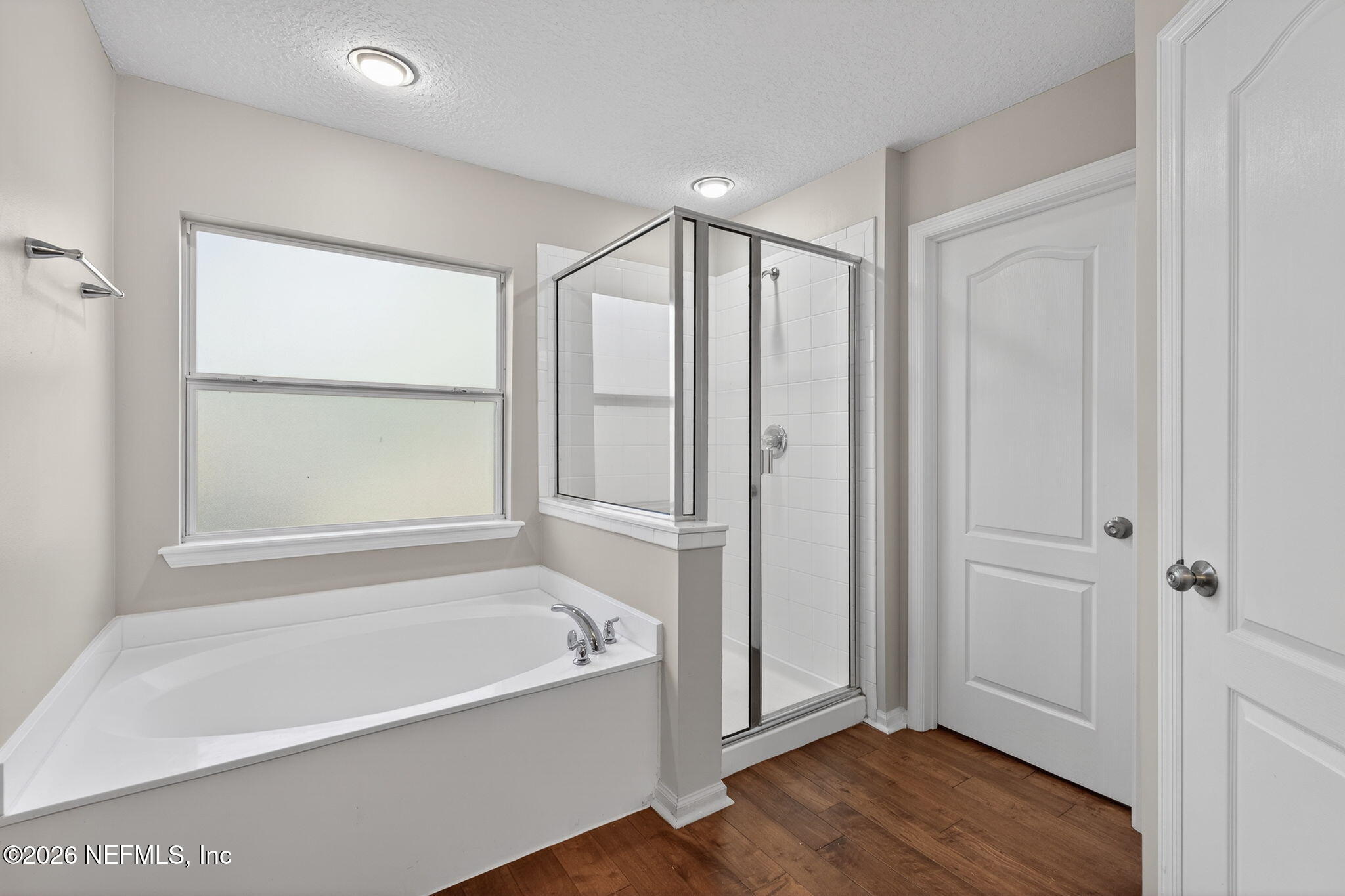 76134 Tideview Lane Yulee, FL 32097 - Photo 37 of 44 a bathroom with a bathtub and a shower