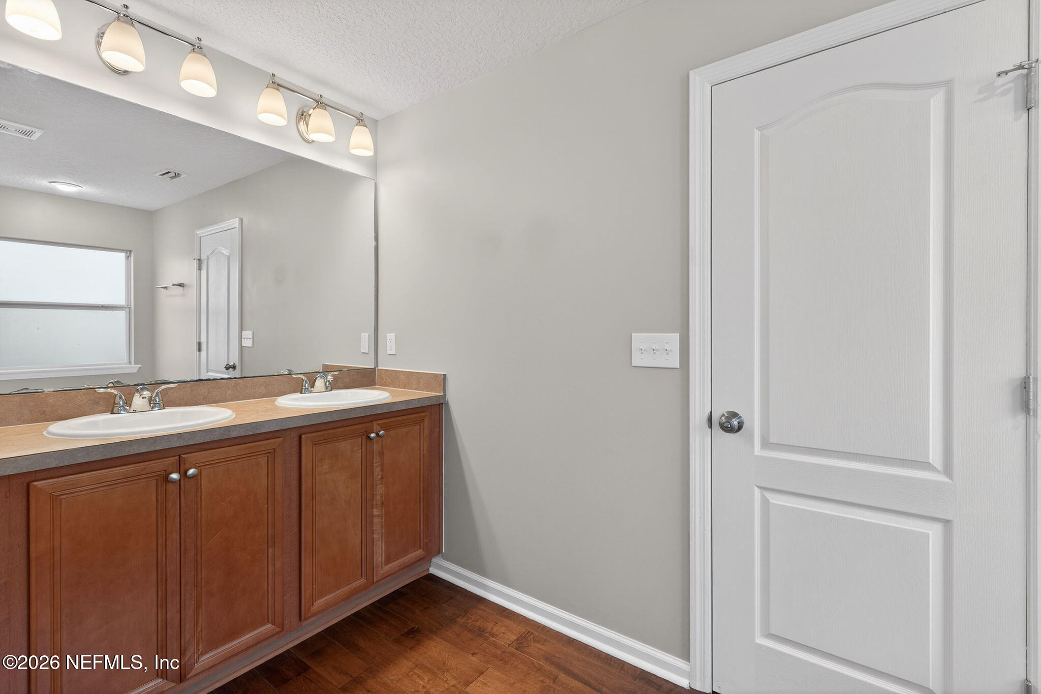 76134 Tideview Lane Yulee, FL 32097 - Photo 39 of 44 a bathroom with a sink and a mirror