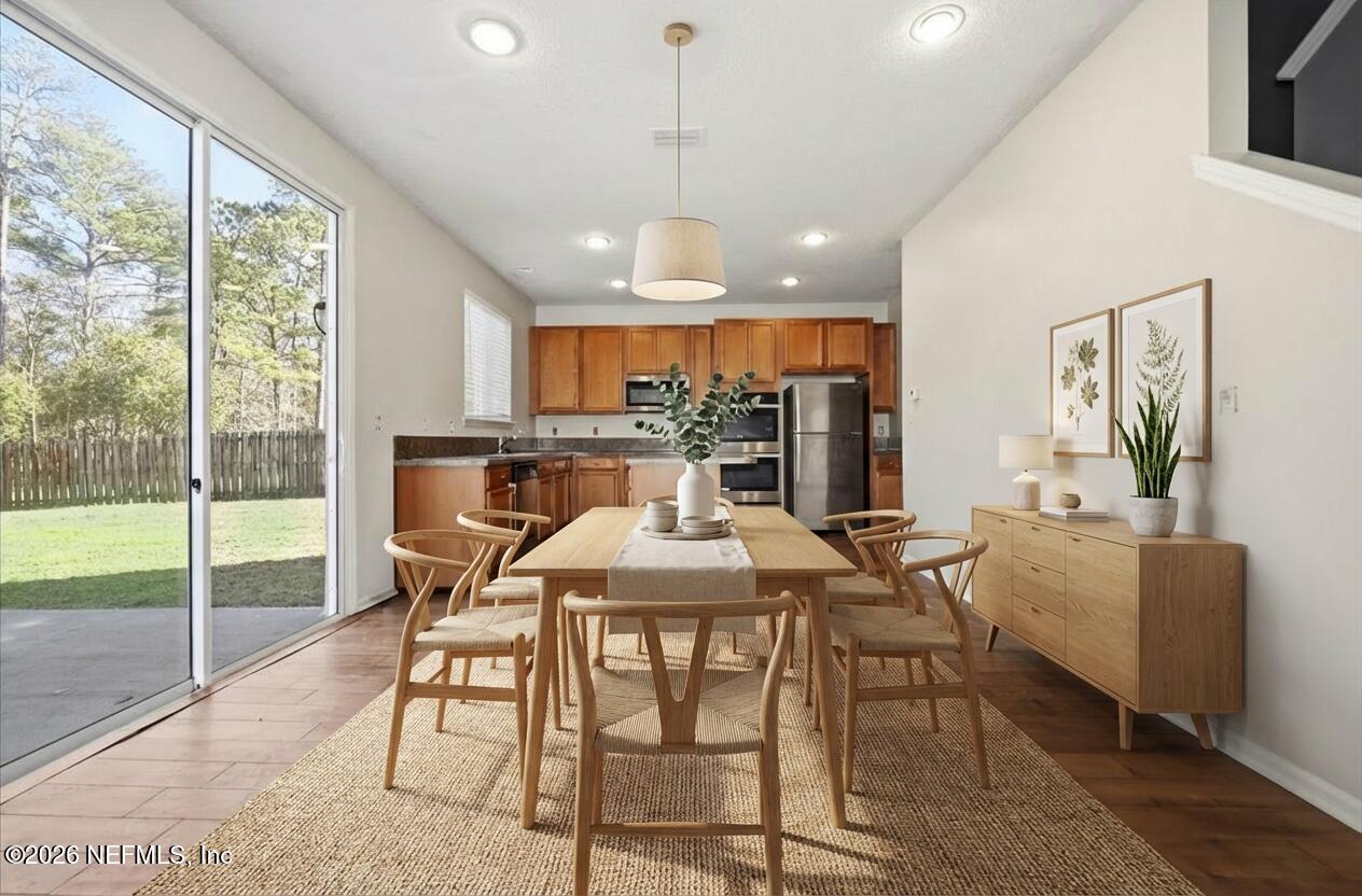 76134 Tideview Lane Yulee, FL 32097 - Photo 6 of 44 a view of a dining room with furniture window and outside view