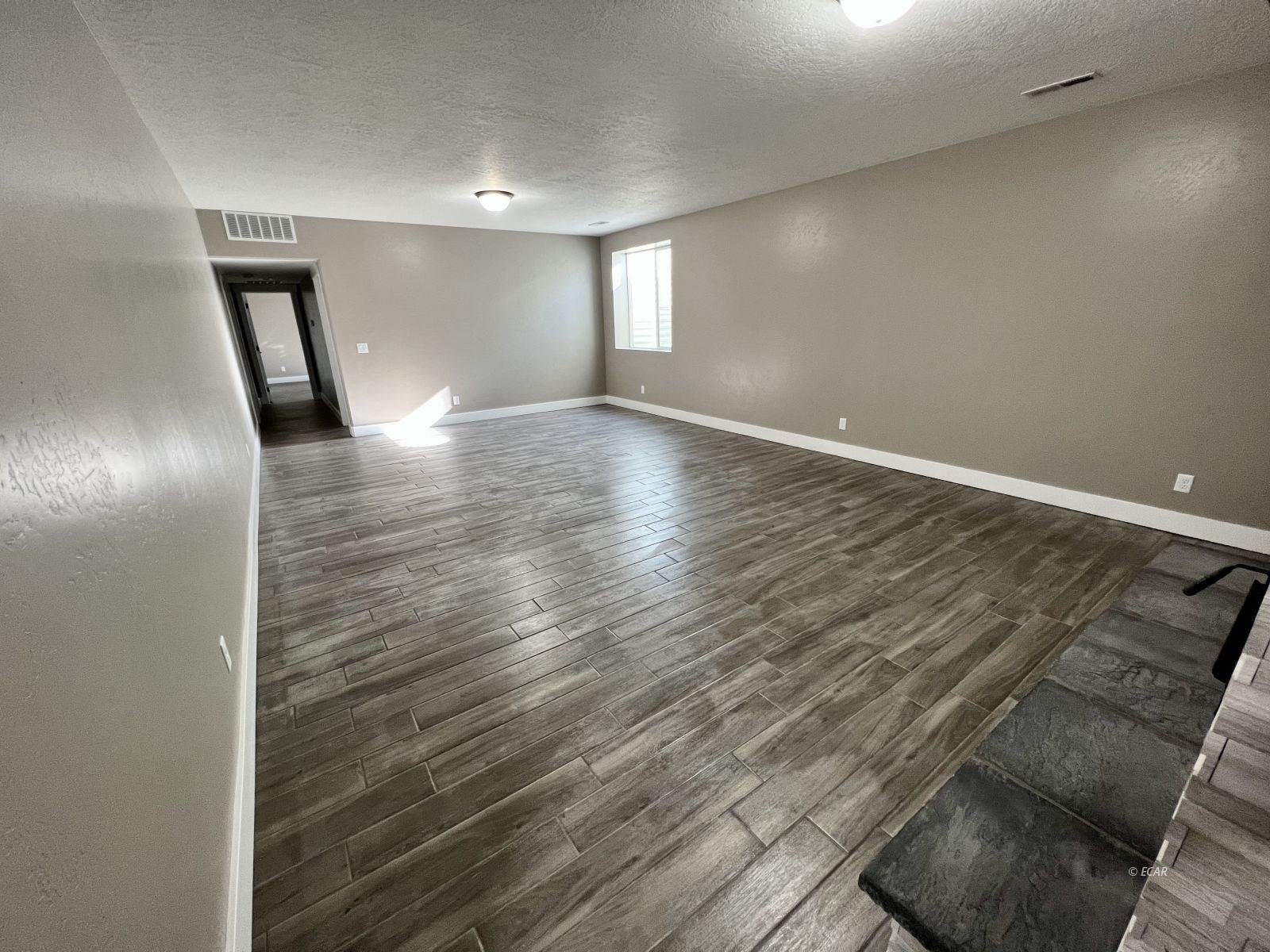 298 Ridgeway Drive Spring Creek, NV 89815 - Photo 32 of 45 a view of empty room with wooden floor