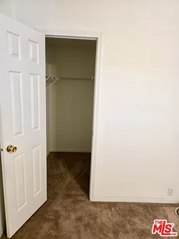 an empty room with wooden door