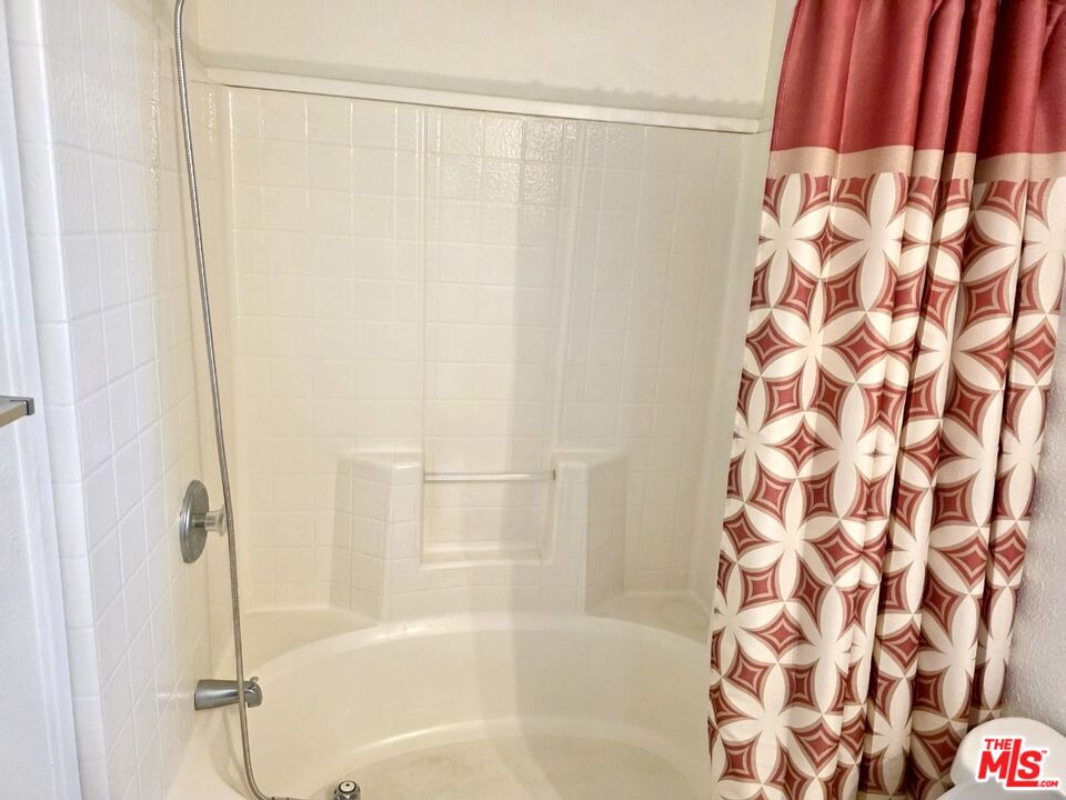 17700 South Avalon Boulevard, Unit 422 Carson, CA 90746 - Photo 12 of 17 a bathroom with a bathtub and shower