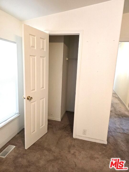 17700 South Avalon Boulevard, Unit 422 Carson, CA 90746 - Photo 13 of 17 an empty room with wooden door