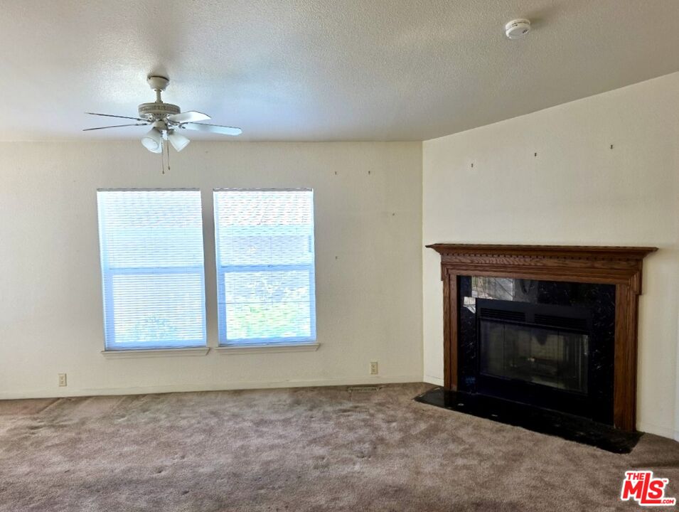 17700 South Avalon Boulevard, Unit 422 Carson, CA 90746 - Photo 3 of 17 an empty room with windows and fireplace