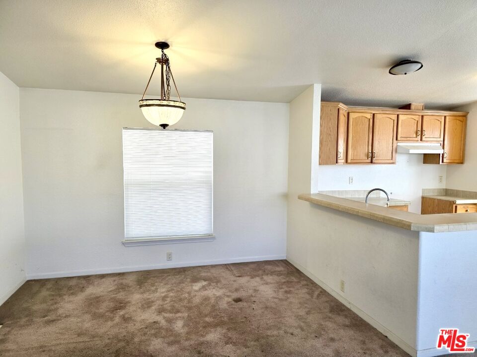 17700 South Avalon Boulevard, Unit 422 Carson, CA 90746 - Photo 5 of 17 a view of a kitchen with a sink and a window