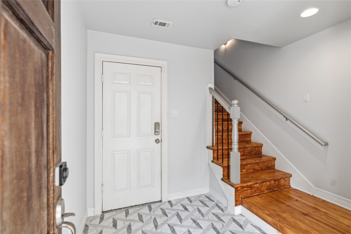 421 Harvard Street, Unit E Houston, TX 77007 - Photo 2 of 21 Entryway with doorway to garage