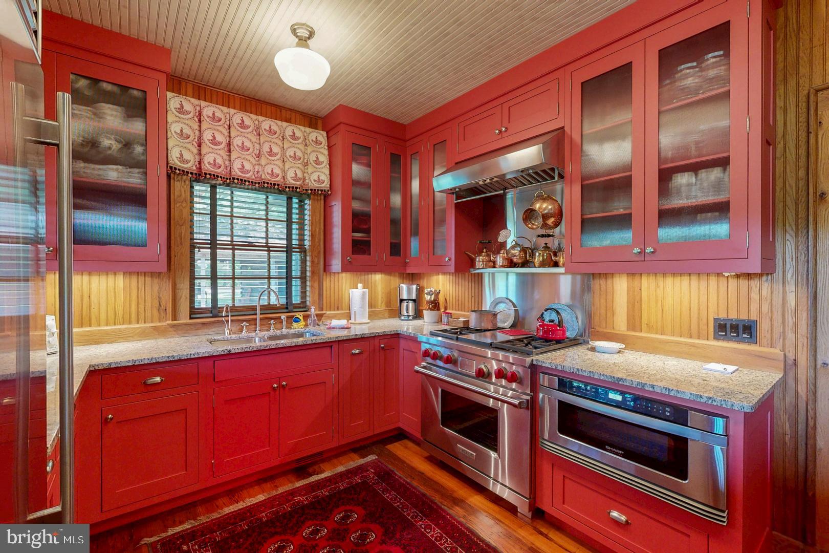 6150 Oxford Road Easton, MD 21601 - Photo 15 of 52 a kitchen with a stove and a sink