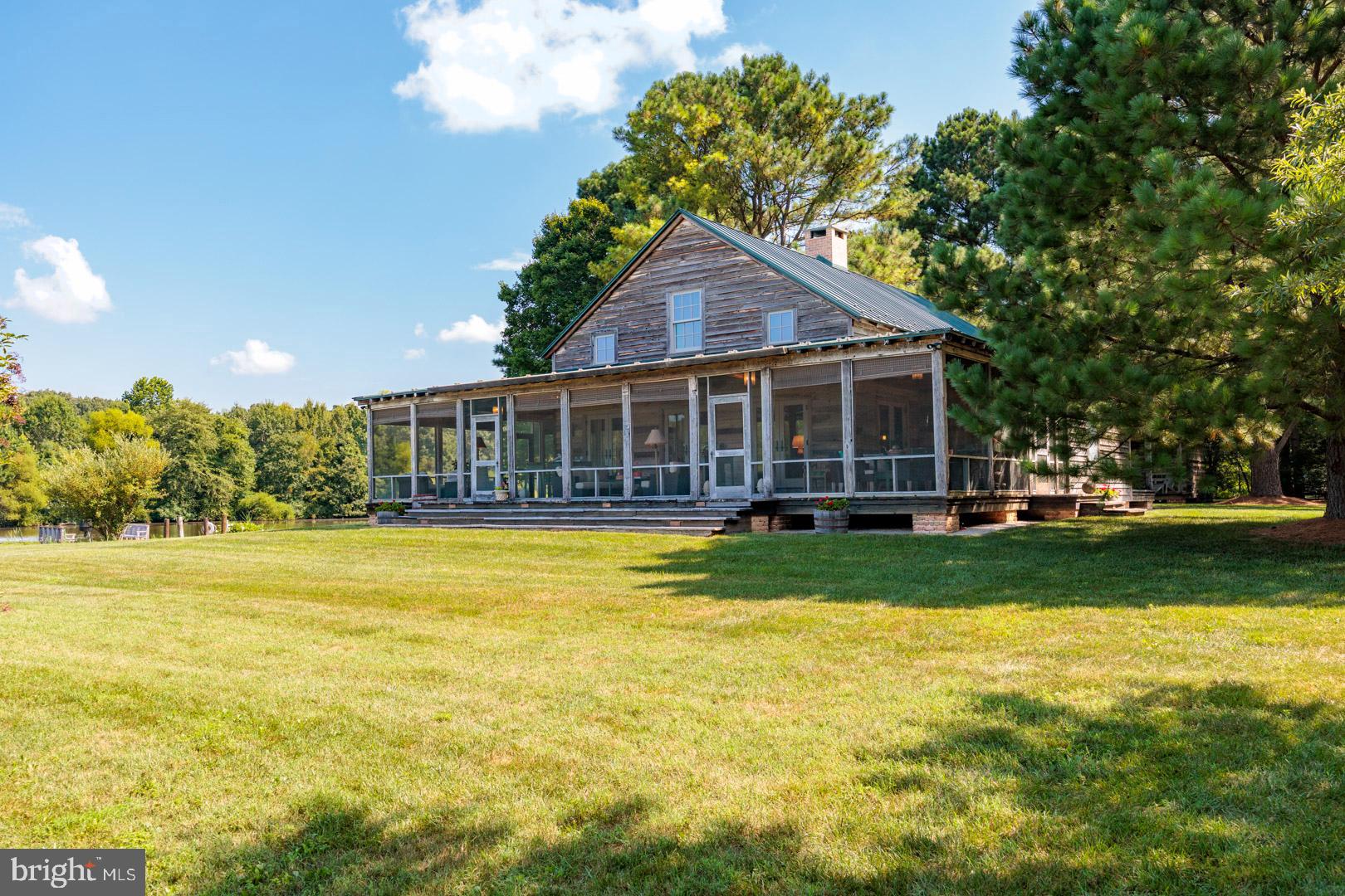 6150 Oxford Road Easton, MD 21601 - Photo 30 of 52 a view of a house with a swimming pool