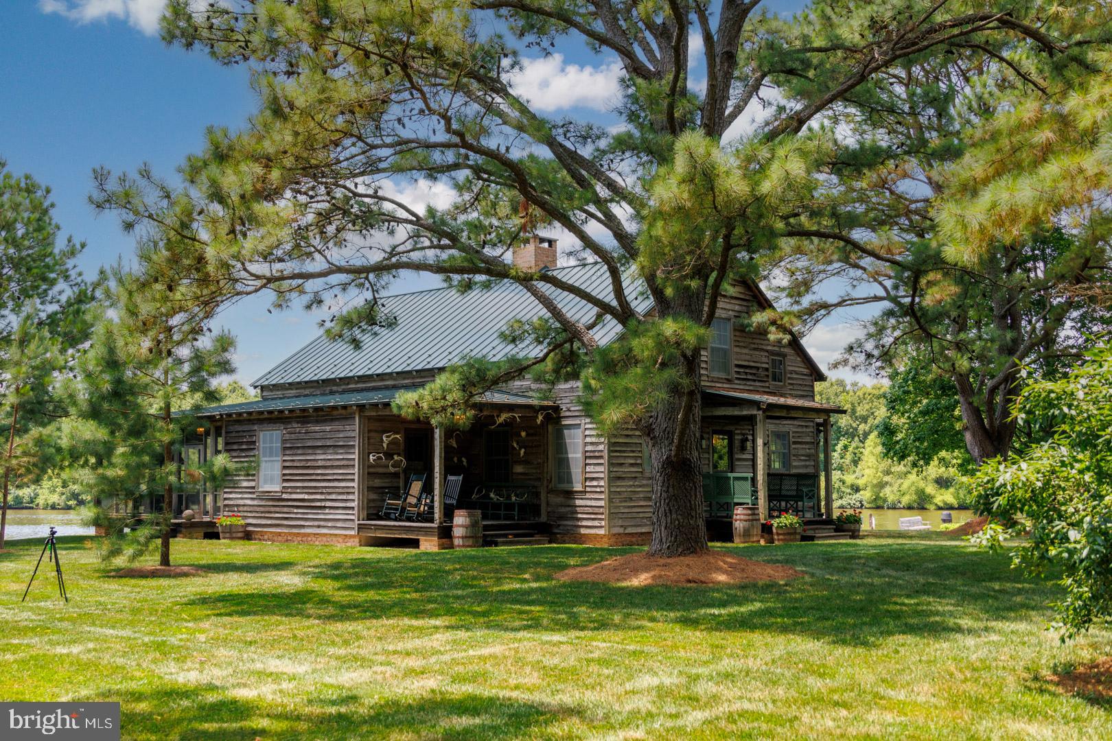 6150 Oxford Road Easton, MD 21601 - Photo 35 of 52 a view of a house with a yard