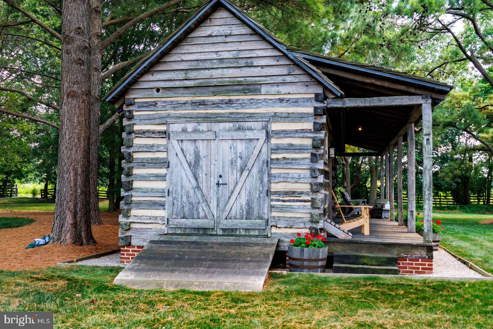 6150 Oxford Road Easton, MD 21601 - Photo 43 of 52 a front view of a house with garden