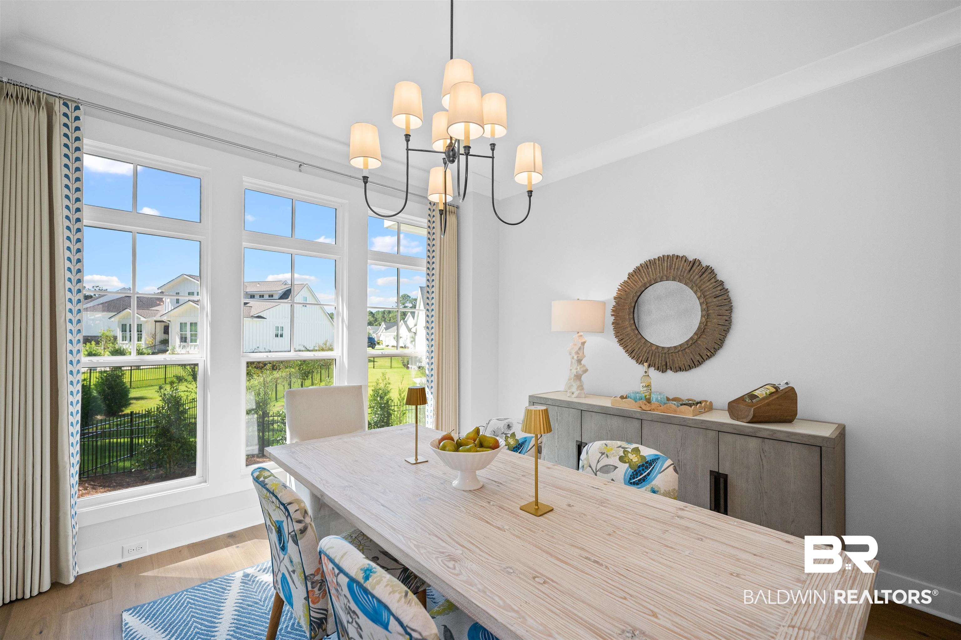 156 Hyacinth Street Fairhope, AL 36532 - Photo 18 of 61 Dining room with dark wood-type flooring and a chandelier