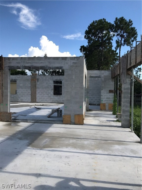 18410 Hepatica Road Fort Myers, FL 33967 - Photo 8 of 11 a view of entrance gate of house and car parked