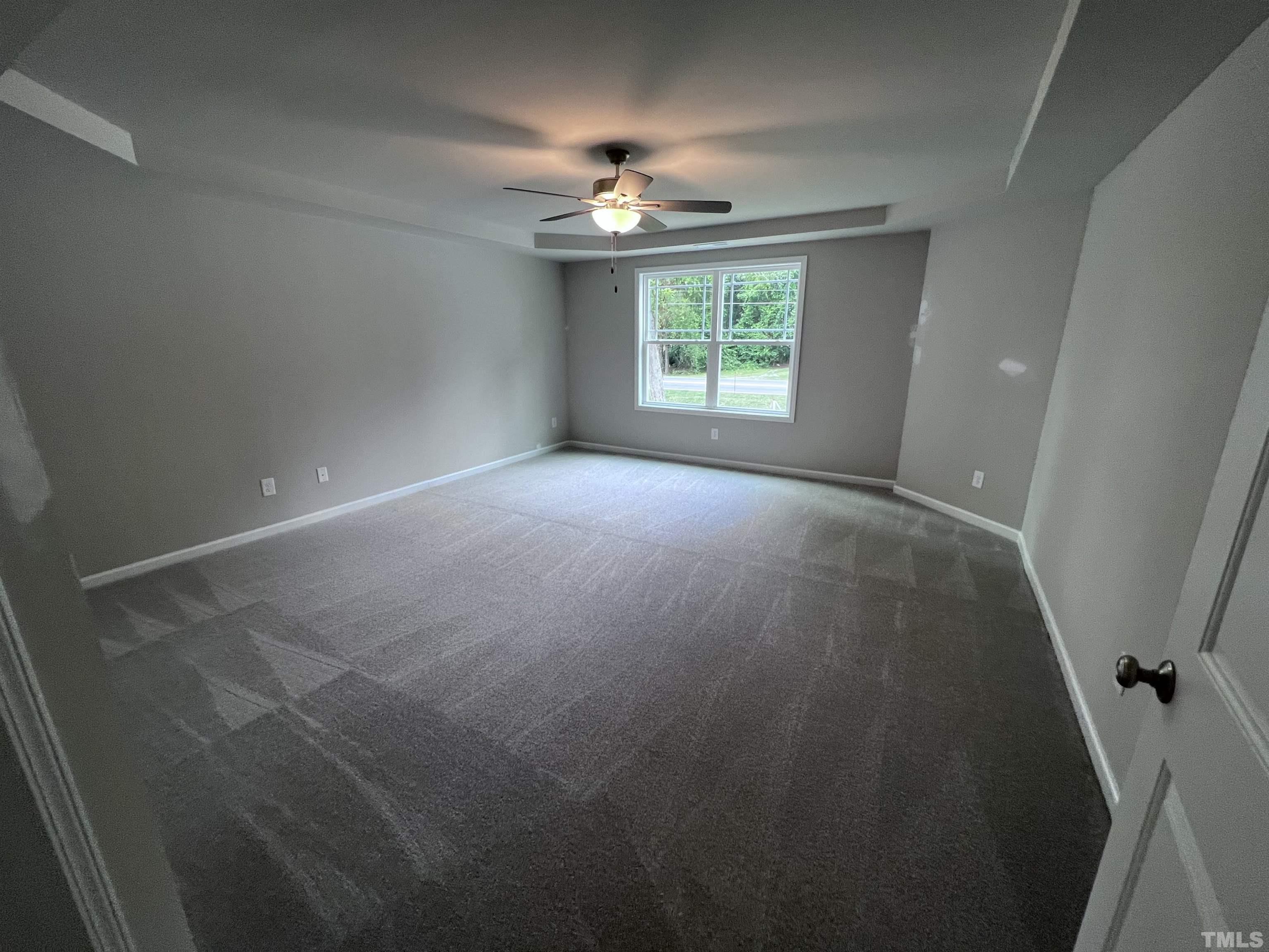390 Roberts Road Willow Spring, NC 27592 - Photo 11 of 18 an empty room with a window