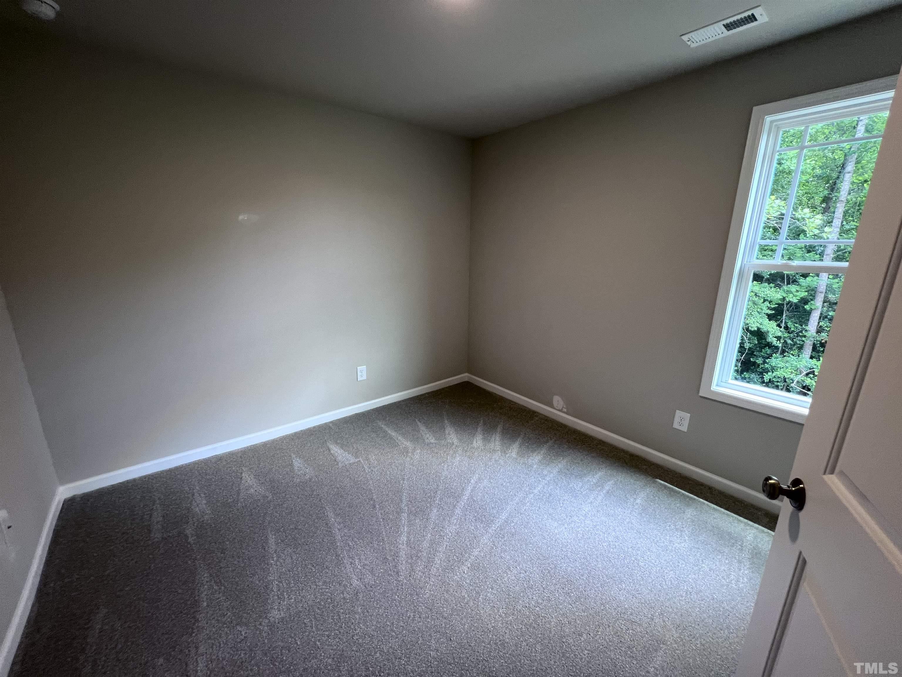 390 Roberts Road Willow Spring, NC 27592 - Photo 15 of 18 a view of a room with window