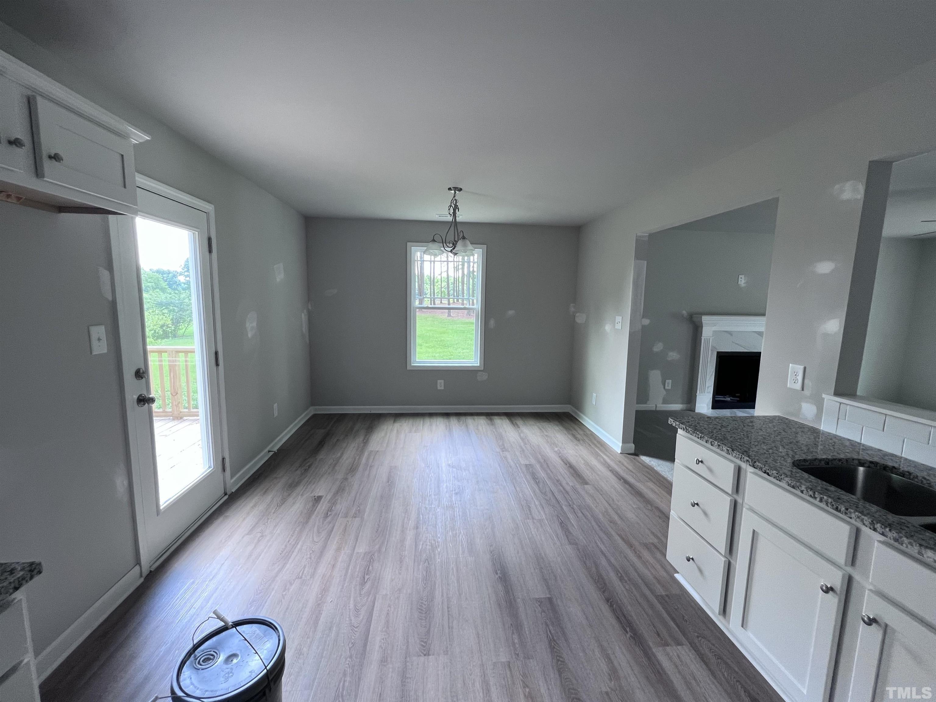 390 Roberts Road Willow Spring, NC 27592 - Photo 9 of 18 a view of a kitchen cabinets and wooden floor
