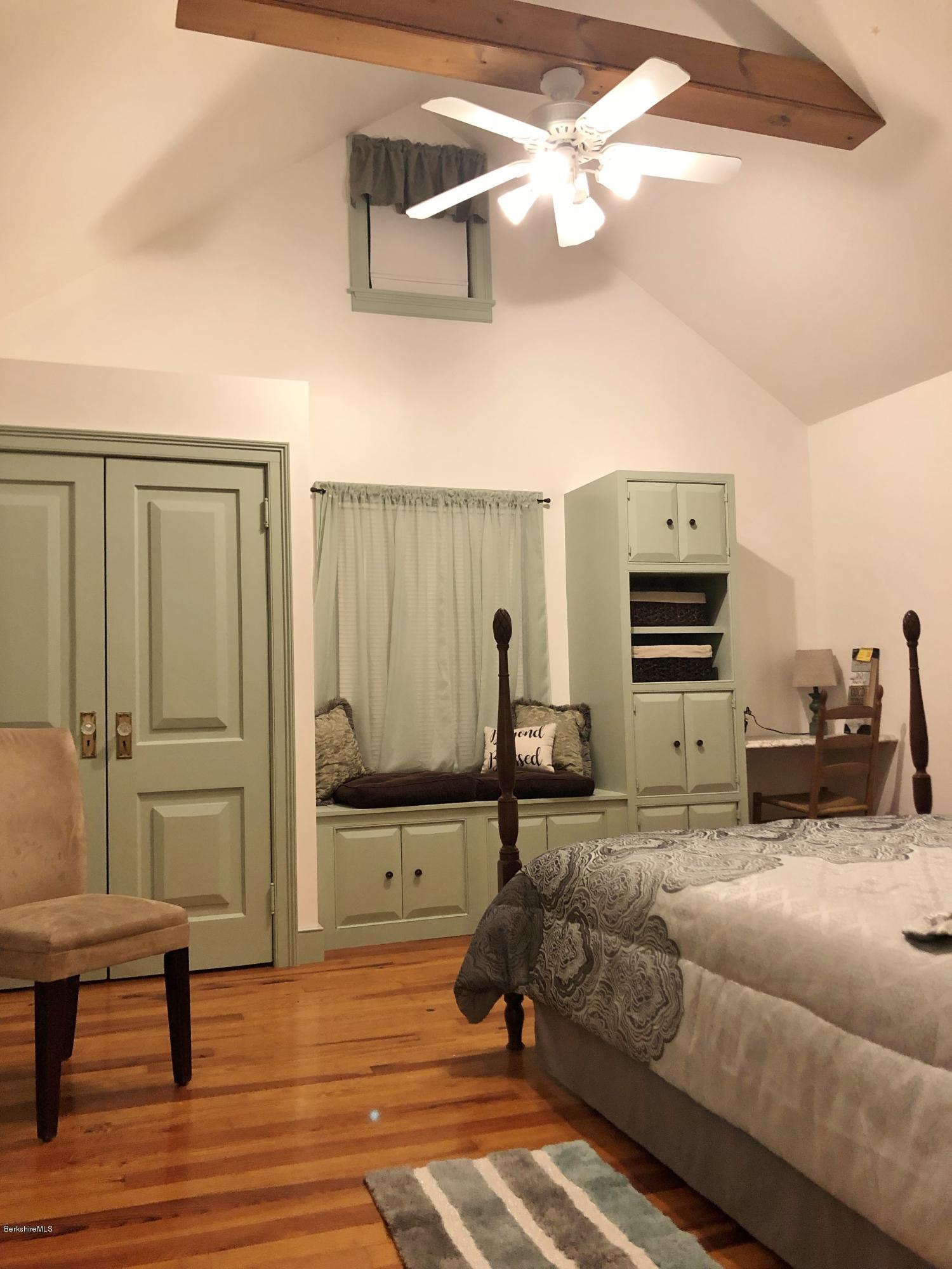 16 Anthony Road Richmond, MA 01201 - Photo 22 of 28 a bedroom with furniture and a chandelier