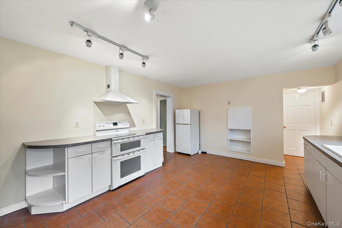 948 Craigville Road Chester, NY 10918 - Photo 13 of 42 a kitchen with cabinets and window